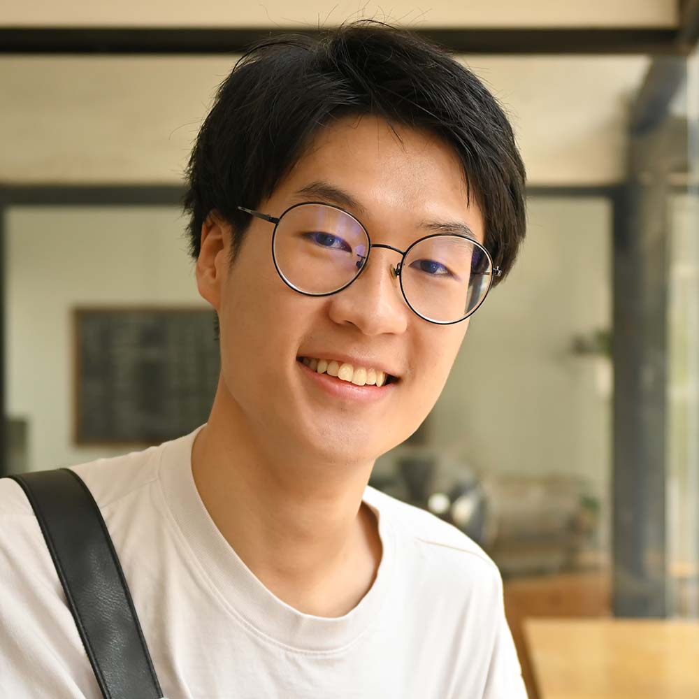 asian male university student in glasses holding b 5TFS3Y8 Clear My Course