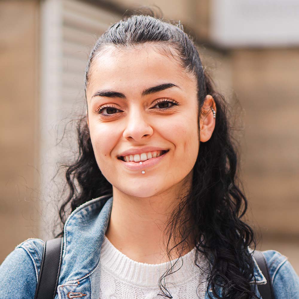 pretty hispanic female student smiling and looking CFSPSYT Clear My Course