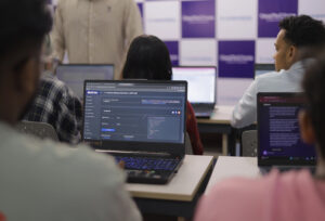 ClearMyCourse students learning SEO and digital marketing in classroom with laptops