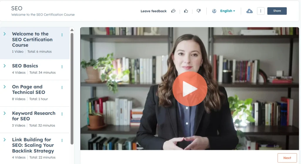 SEO certification course dashboard with video lesson, modules list, and instructor on screen